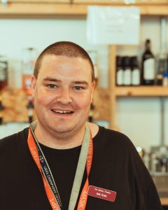 Volunteer behind bar