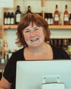 Volunteer behind bar