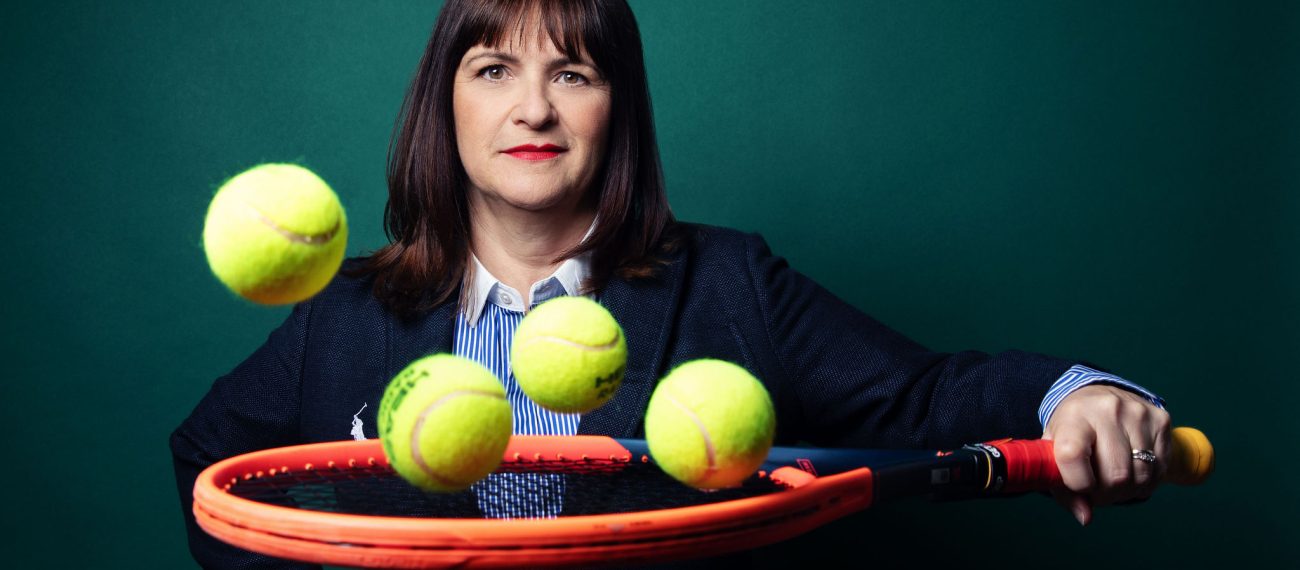 Pauline Eyre holding a tennis racket