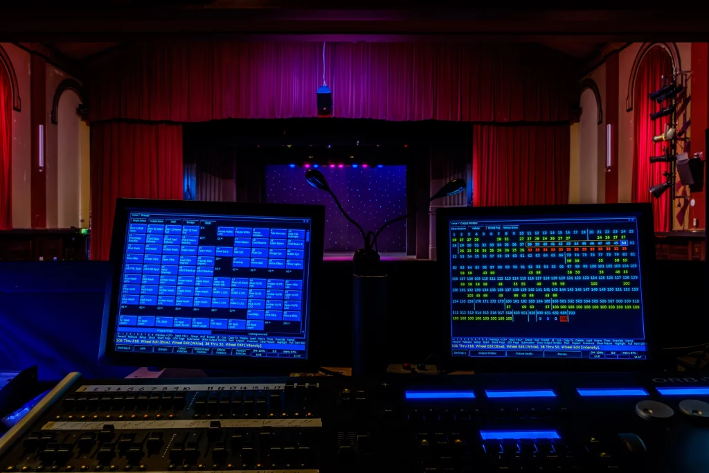 Professional theatre lighting control console used to operate stage lighting during a live production.
